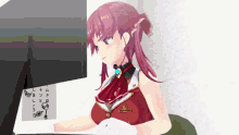a girl with red hair is sitting in front of a computer
