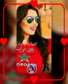 a picture of a woman wearing sunglasses and a red shirt that says oro