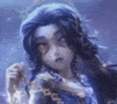 a close up of a girl with long hair holding a necklace .