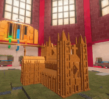 a wooden model of a building with a cross on the top of it