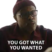 a man wearing glasses and a beanie has the words you got what you wanted on his face