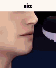 a close up of a man 's face with the words `` nice '' written above it .