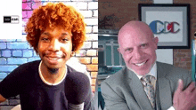 a man with red curly hair and a bald man in a suit are smiling .