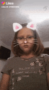 a young girl wearing glasses and cat ears is looking at the camera .