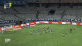 a soccer game is being played in an empty stadium with betano advertisements on the sidelines
