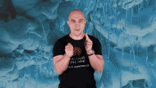 a man wearing a black t-shirt that says pacific marketing giving a thumbs up