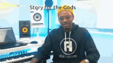 a man is sitting in front of a keyboard with the words story for the gods written above him .
