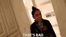 a woman in a black shirt that says that 's bad on it