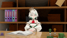 a girl with white hair and green eyes is sitting at a desk with a book