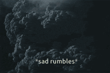 a dark cloudy sky with the words sad rumbles