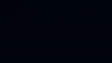 a blue light is coming out of the center of a clock