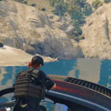 a man in a helmet stands on a boat in a video game