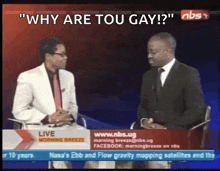 two men are sitting in front of a screen that says why are you gay