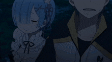 a boy and a girl are standing next to each other and the girl has a bow on her head