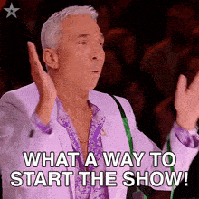 a man in a purple suit is asking what a way to start the show .
