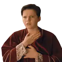 a young boy in a red robe holds his chest