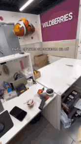 a wildberries sign hangs on a purple wall