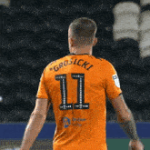 a soccer player with the name grosicki on his back