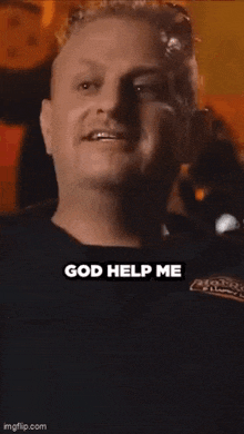 a man in a black shirt with the words `` god help me crawler '' written on it .