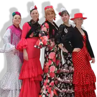 a group of women wearing red and black polka dot dresses pose for a photo