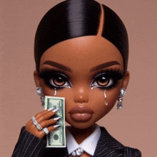 a doll in a suit is holding a dollar bill