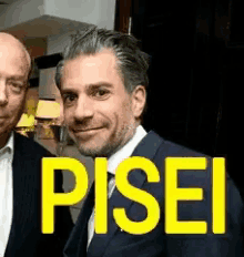 two men standing next to each other with the word pisei written in yellow