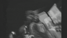 a blurry black and white photo of a person