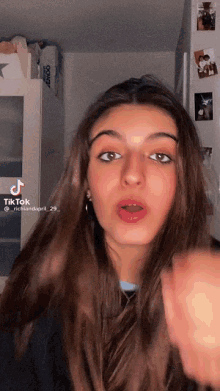 a woman 's face is shown in a tiktok video with the hashtag nicholasapril_29