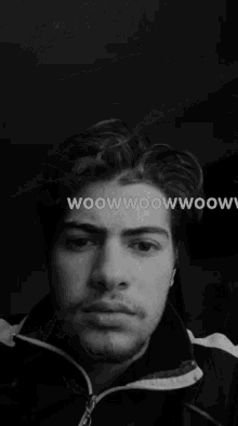 a close up of a man 's face with the words woowwoowwoow