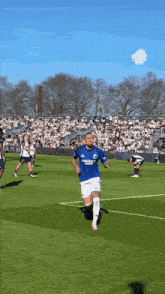 a soccer player wearing a blue jersey that says unibet on it
