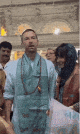 a man with a scarf around his neck that says shiva on it