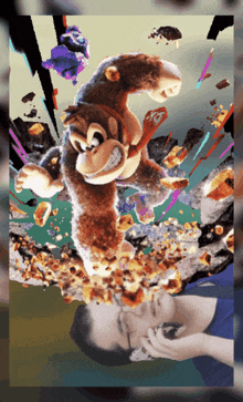 a man is laying on the ground in front of a donkey kong painting