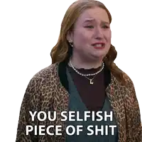 a woman wearing a leopard print jacket is crying and says you selfish piece of shit