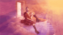 a man in a red dress is sitting in the clouds
