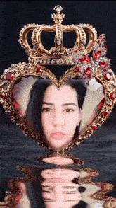 a woman in a heart shaped frame with a crown