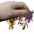 a hand is holding two cartoon characters , one of which is jotaro kujo .