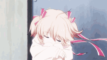 a girl with blonde hair and pink ribbons in her hair is hugging herself