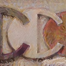 a close up of a painting of the letter c on a wall