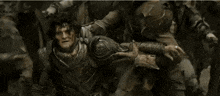 a man is holding another man 's neck and says `` dwarves . ''