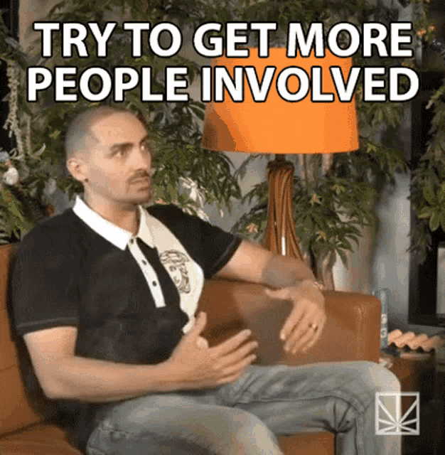 a man is sitting on a couch with the words 