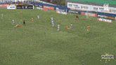 a soccer game is being played on a field with paybrokers advertisements