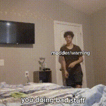 a man standing in a bedroom with the words " you doing bad stuff " written on the bottom