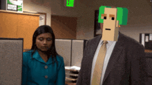 a man in a suit and tie is standing next to a woman in a blue suit