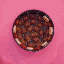 a pan filled with bananas strawberries and kinder bars