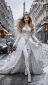 a woman in a white dress is walking down a snowy street with pixverse.ai written on the bottom