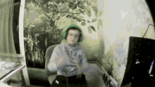 a boy wearing headphones and a sweatshirt that says abercrombie on it
