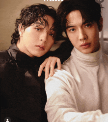 two men are posing for a picture and one has his arm around the shoulder of the other
