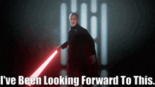 a poster of a man holding a red lightsaber with the words " i 've been looking forward to this " below him