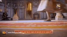 an ad for sony television shows a woman walking on a rug