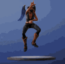 a statue of a woman in a cowboy hat is dancing